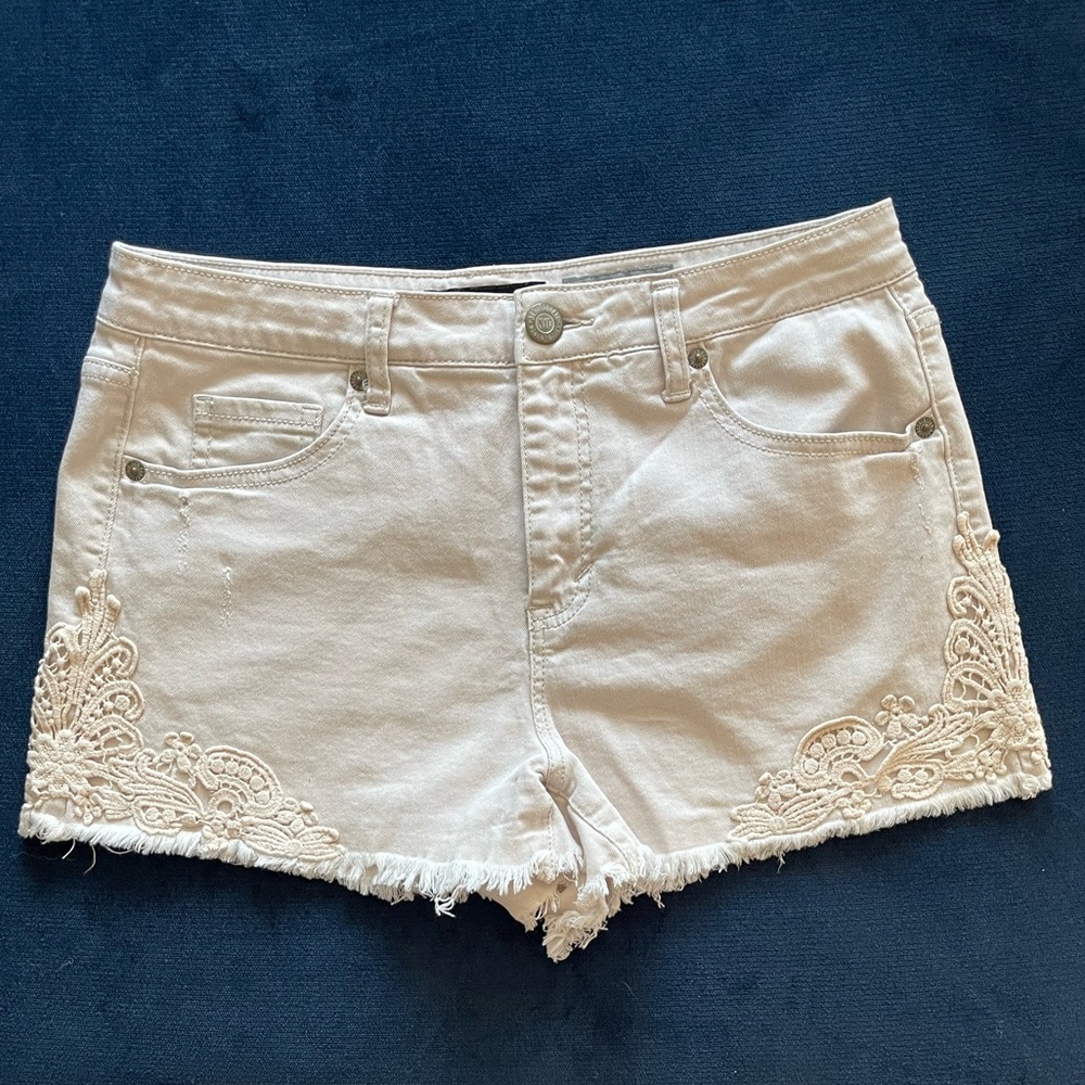 Cream shorts with design on the side